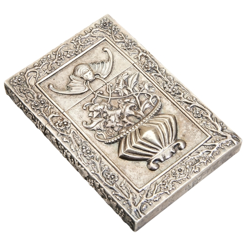 313 - A CHINESE EXPORT SILVER CARD CASECANTON, CIRCA 1900decorated in relief with two scaly dragons to one... 