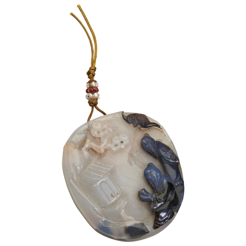 299 - A CARVED AGATE PENDANT 19TH/20TH CENTURY carved with two scholars walking in landscape, with carved ... 