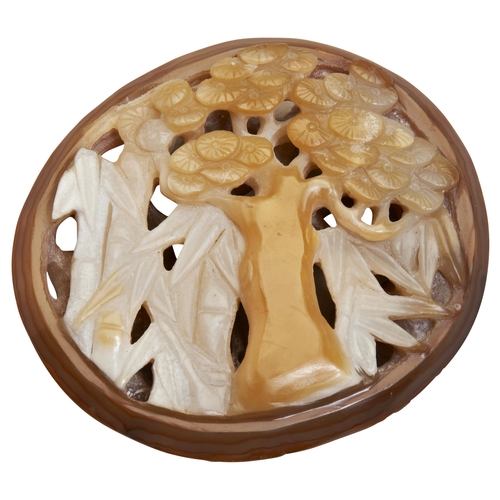 300 - A CARVED AGATE PAPERWEIGHT19TH/20TH CENTURY openwork and carved 'three winter friends', plum blossom... 