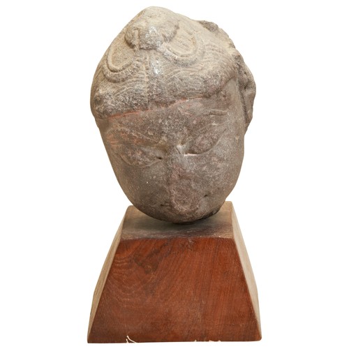 436 - A FEMALE HEAD STONE WITH HEADDRESSLATE GUPUTA PERIOD (320-600 AD) a red sandstone carved female head... 