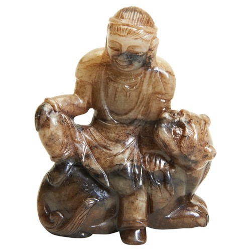 283 - A BROWN JADE FIGURE OF BODHISATTVA SEATED ON LION19TH/20TH CENTURY brown jade carved in a figure of ... 