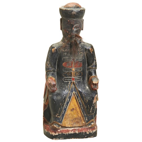 383 - A CARVED LACQUERED WOOD FIGURE19TH CENTURYa wooden figure probably a local god from the Southern Chi... 