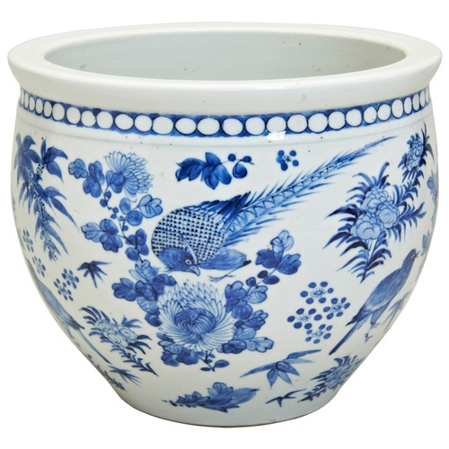 93 - A BLUE AND WHITE JARDINIEREQING DYNASTY, 19TH CENTURY the sides painted in underglaze blue with bird... 