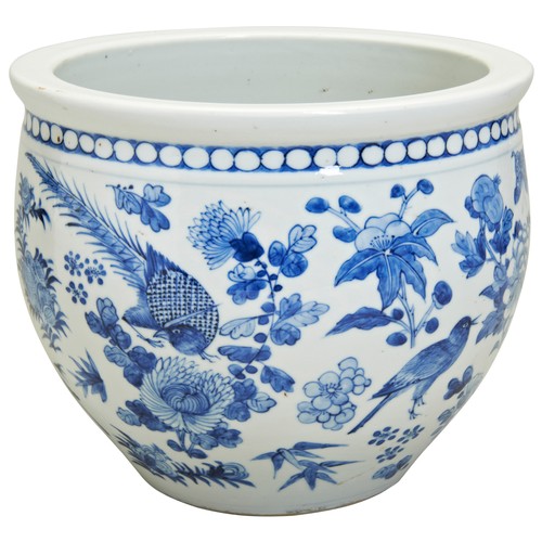 93 - A BLUE AND WHITE JARDINIEREQING DYNASTY, 19TH CENTURY the sides painted in underglaze blue with bird... 