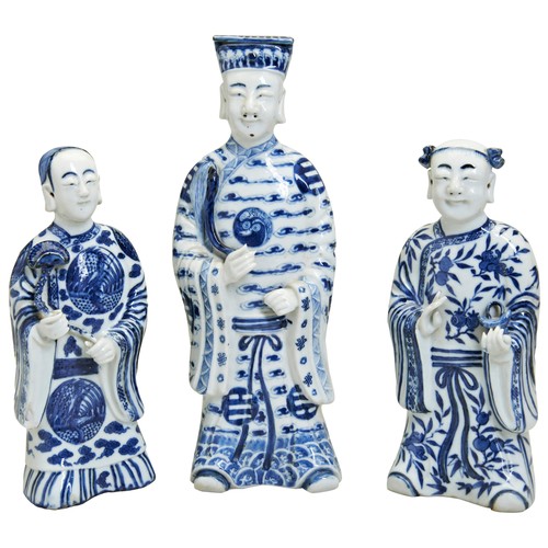 110 - THREE BLUE AND WHITE FIGURES OF IMMORTALS LATE QING DYNASTYthe standing figures in long flowing robe... 