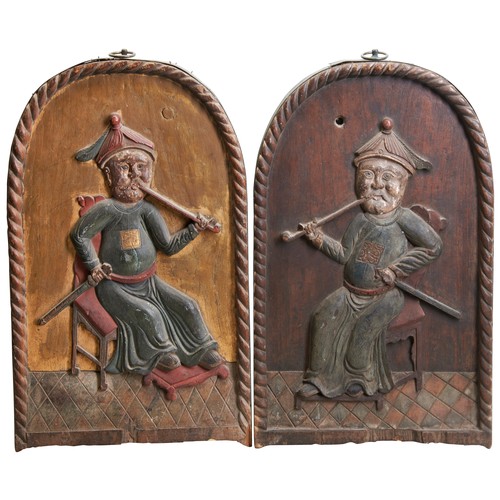 445 - A PAIR OF SOUTH EAST ASIAN CARVED WOOD PANELSLATE 19TH / EARLY 20TH CENTURYeach carved in high relie... 