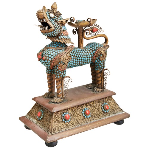 443 - A GILT-METAL, TURQUOISE AND CORAL BUDDHIST LION VESSELTIBET, 20TH CENTURYthe beast standing four squ... 