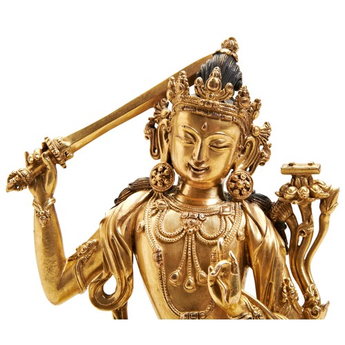 14 - A FINE GILT BRONZE FIGURE OF MANJUSHRIYONGLE SIX CHARACTER MARK AND PROBABLY OF THE PERIOD 明 铜鎏金文殊造像... 