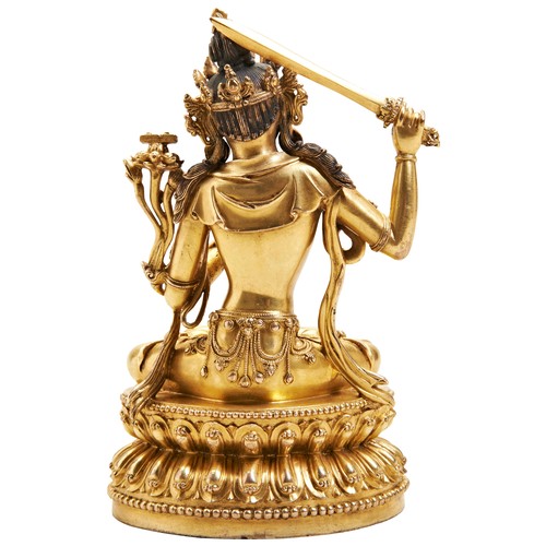 14 - A FINE GILT BRONZE FIGURE OF MANJUSHRIYONGLE SIX CHARACTER MARK AND PROBABLY OF THE PERIOD 明 铜鎏金文殊造像... 