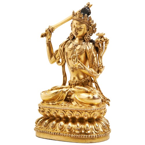 14 - A FINE GILT BRONZE FIGURE OF MANJUSHRIYONGLE SIX CHARACTER MARK AND PROBABLY OF THE PERIOD 明 铜鎏金文殊造像... 