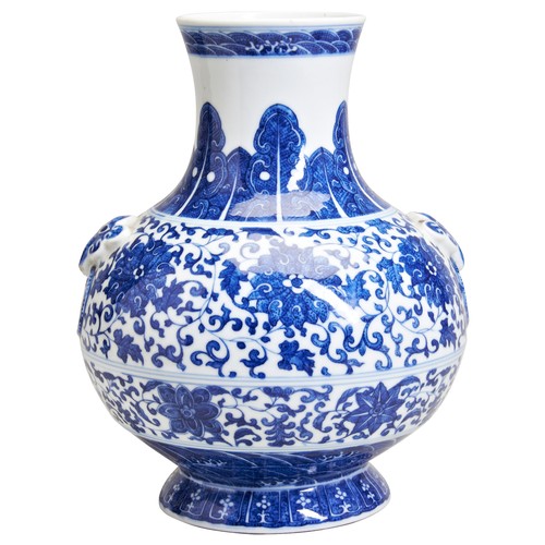 99 - A MING-STYLE BLUE & WHITE 'LOTUS' VASEQING DYNASTY, 19TH CENTURYof compressed Hu-form, the sides... 