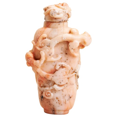 257 - A CARVED CORAL SNUFF BOTTLE QING DYNASTY, 19TH CENTURY a pinkish coral snuff bottle with carved Chil... 