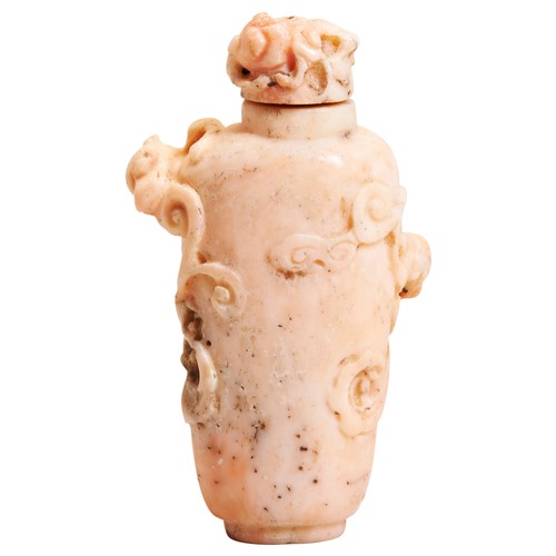 257 - A CARVED CORAL SNUFF BOTTLE QING DYNASTY, 19TH CENTURY a pinkish coral snuff bottle with carved Chil... 