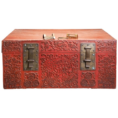 350 - A LARGE CHINESE RED LEATHER TRUNK QING DYNASTY, 19TH CENTURYthe sides with relief decoration of scro... 