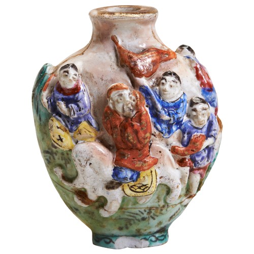 272 - A FAMILLE ROSE MOULDED PORCELAIN SNUFF BOTTLEQING DYNASTY, 19TH CENTURY with boys playing, bears an ... 