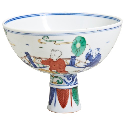 221 - A DOUCAI-DECORATED STEM BOWLLATE QING / REPUBLIC PERIODdecorated with boys in a fenced garden engage... 