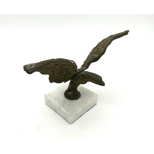 10 - TWO EAGLE CAR MASCOTSTwo brass car mascots in the form of an Eagle, mounted on marble bases. Both c.... 