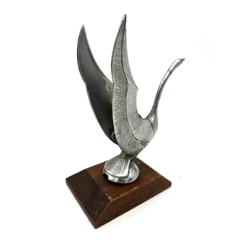 12 - SWAN CAR MASCOTDepicting a swan taking flight. Plated brass, 16cm high, on wooden base.Ref 58.... 