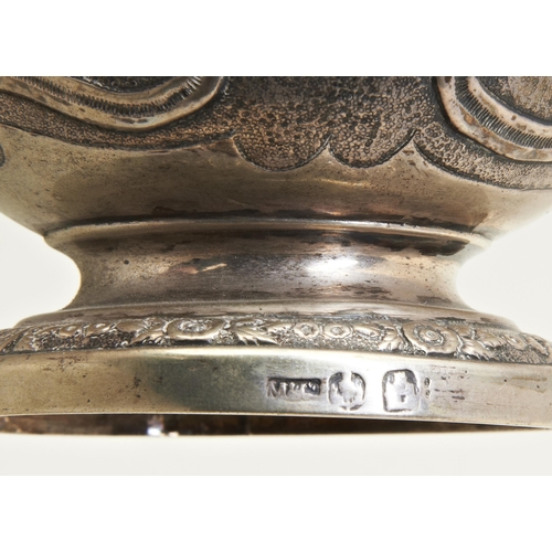 28 - AN EMBOSSED LIDDED MUG, MIDDLETON & CO., CALCUTTA C.1850 . Chased all over with scrolls and flow... 