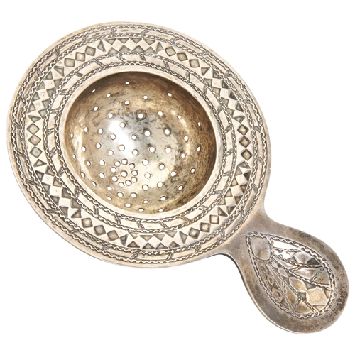 88 - A LIBERTY & CO TEA STRAINER, BIRMINGHAM 1938.11.2 cm.47 g.PROVENANCE: From the Private Collectio... 