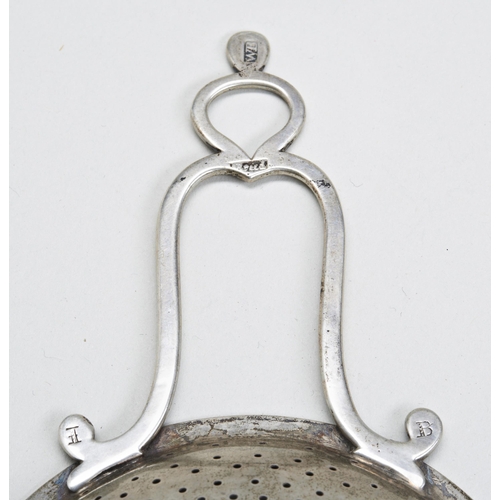 21 - AN EARLY AMERICAN PUNCH STRAINER, WILLIAM BREED, BOSTON C.1745. With a suspension loop to the end of... 