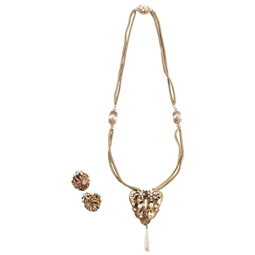 295 - MIRIAM HASKELL; A FAUX PEARL AND GILT NECKLACEthe heart shaped pendant with chased scroll work and f... 