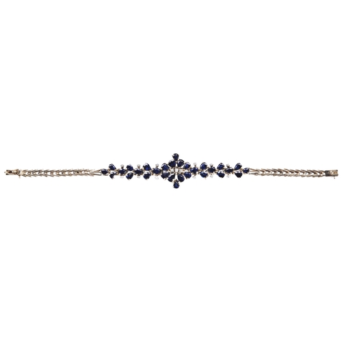 328 - A SAPPHIRE BRACELETset with three circular-cut diamonds to the centre and pear-cut sapphires, to an ... 