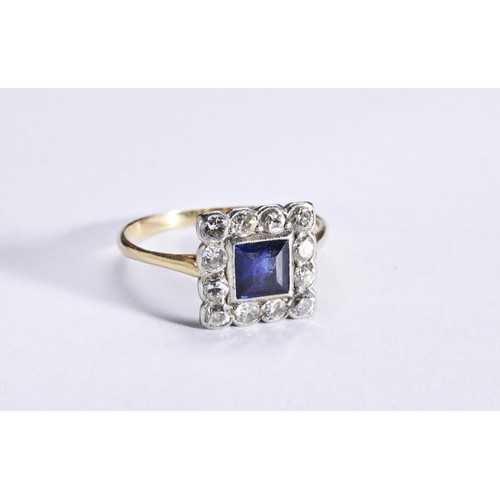 337 - A SAPPHIRE AND DIAMOND PLAQUE RING, CIRCA 1915the square-cut sapphire rubover set within a border of... 