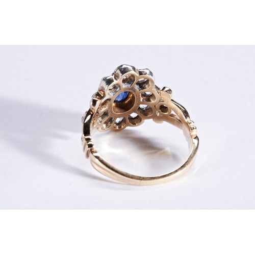 345 - A SAPPHIRE AND DIAMOND RING, CIRCA 1880the oval mixed-cut sapphire, cut down collet set, within a bo... 