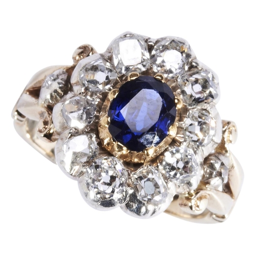 345 - A SAPPHIRE AND DIAMOND RING, CIRCA 1880the oval mixed-cut sapphire, cut down collet set, within a bo... 