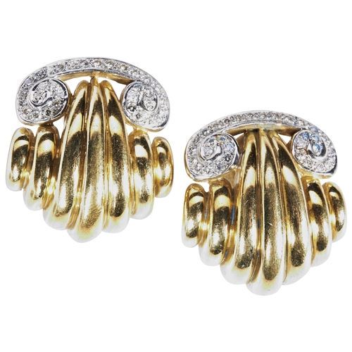 311 - A PAIR OF GOLD AND DIAMOND CLIPS, CIRCA 1950each modelled as a shell with scroll surmount set with t... 