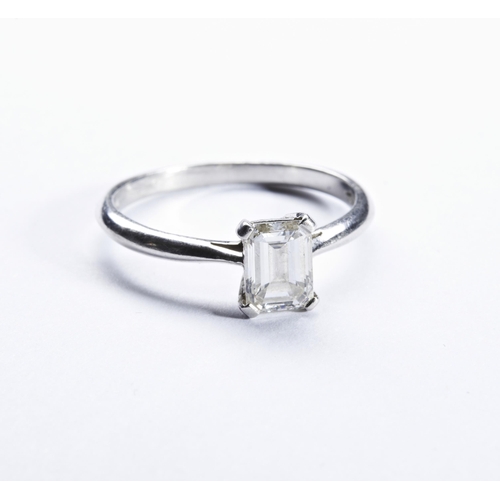 272 - HIRSCH; A SINGLE STONE DIAMOND RINGthe emerald-cut diamond four claw set, between pierced shoulders ... 