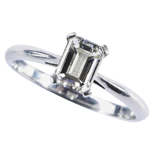 272 - HIRSCH; A SINGLE STONE DIAMOND RINGthe emerald-cut diamond four claw set, between pierced shoulders ... 