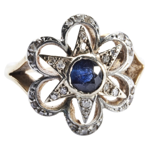 343 - A SAPPHIRE AND DIAMOND RING, CIRCA 1900the circular mixed-cut sapphire collet set within a six ray s... 