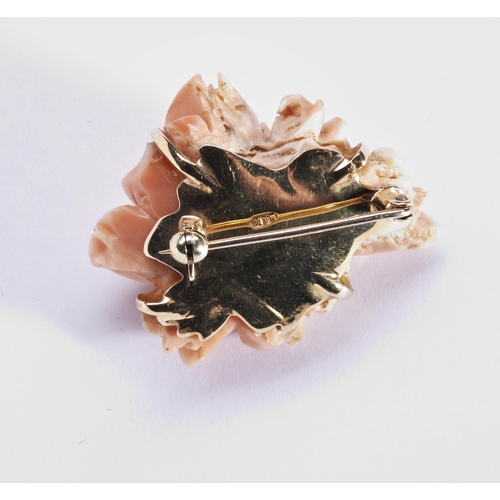 273 - CORAL FLOWER BROOCHCarved as a rose, on a brooch fitting.Stamped '14k'Total weight 14.7gms3.5cm wide... 