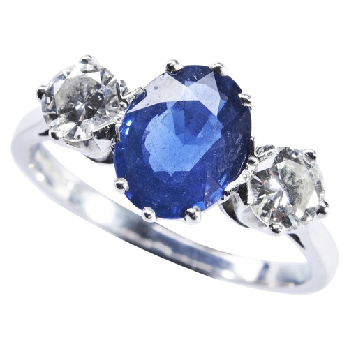 329 - A SAPPHIRE AND DIAMOND THREE STONE RINGthe oval mixed-cut sapphire,  set between brilliant-cut diamo... 