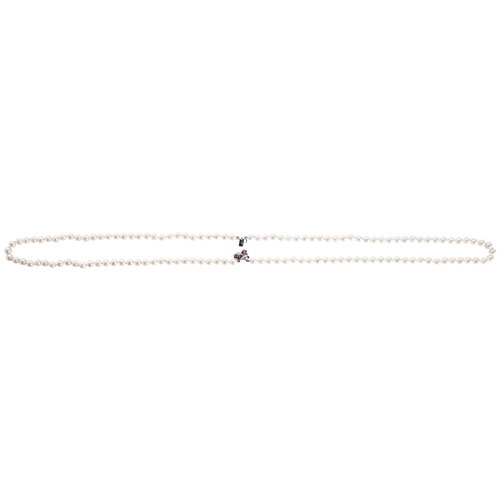 281 - A CULTURED PEARL NECKLACE WITH RUBY AND DIAMOND CLASP the two uniform rows of cultured pearls on a r... 