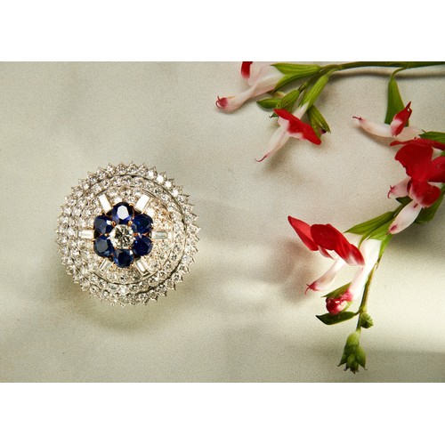 342 - SAPPHIRE AND DIAMOND BROOCH, CIRCA 1940the domed mount set to the center with a brilliant-cut diamon... 