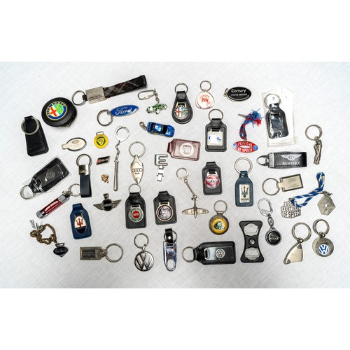 329 - C. 50 DEALER AND MANUFACTURER KEYRINGS Brands covered inlcude Lotus, Maserati, Saab, Maserati, Ford,... 