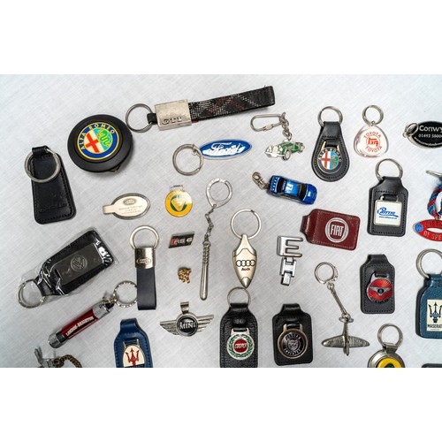 329 - C. 50 DEALER AND MANUFACTURER KEYRINGS Brands covered inlcude Lotus, Maserati, Saab, Maserati, Ford,... 