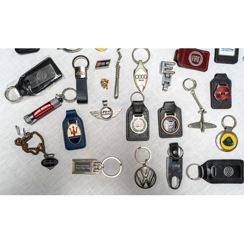 329 - C. 50 DEALER AND MANUFACTURER KEYRINGS Brands covered inlcude Lotus, Maserati, Saab, Maserati, Ford,... 