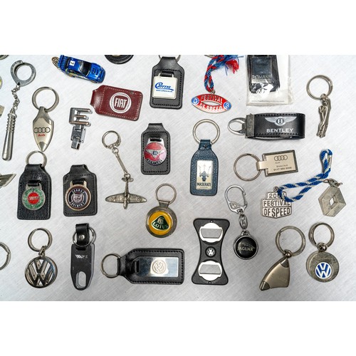 329 - C. 50 DEALER AND MANUFACTURER KEYRINGS Brands covered inlcude Lotus, Maserati, Saab, Maserati, Ford,... 