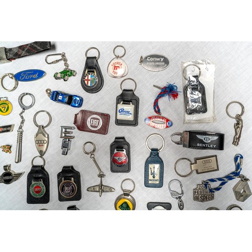 329 - C. 50 DEALER AND MANUFACTURER KEYRINGS Brands covered inlcude Lotus, Maserati, Saab, Maserati, Ford,... 