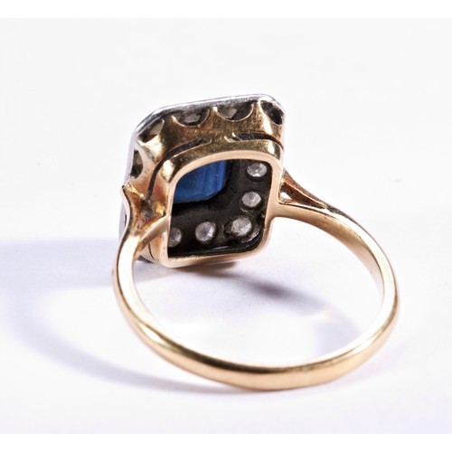 285 - A SAPPHIRE AND DIAMOND PLAQUE RING, CIRCA 1940the cushion-cut sapphire collet set within a diamond s... 