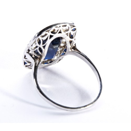 286 - AN ART DECO CUSHION CUT SAPPHIRE AND DIAMOND PLAQUE RING, CIRCA 1930 the cushion-cut sapphire set wi... 