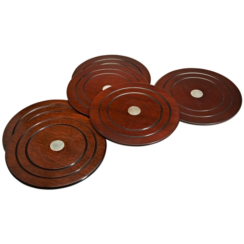 780 - PLACE SETTINGS WITH SILVER DISC CENTRE (SEVEN) 23cm diameter along with three coasters (10cm diamete... 