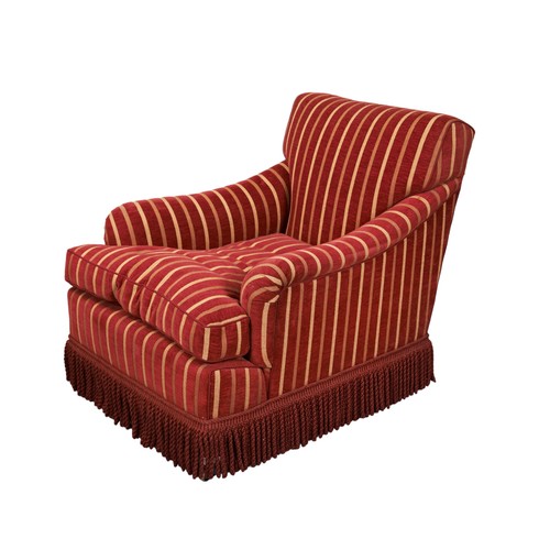 489 - IN THE MANNER OF HOWARD AND SONS, AN UPHOLSTERED ELEGANT CLUB CHAIR covered in a rich burgundy fabri... 