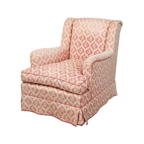 494 - A PORTMAN UPHOLSTERY ARMCHAIR covered in a pale lattice patterned chintz with matching piping raised... 