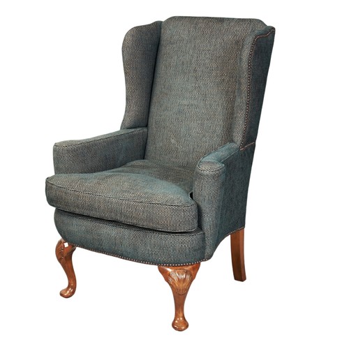 499 - A QUEEN ANNE STYLE WING ARMCHAIR, 20TH CENTURY covered in a woollen bottle green fabric raised on sh... 