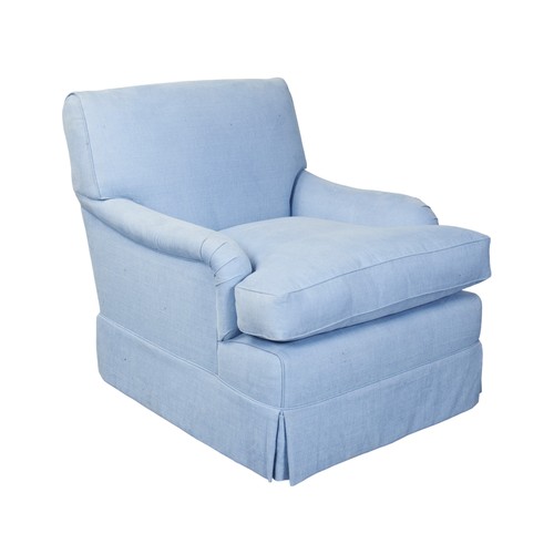 500 - AN UPHOLSTERED ARMCHAIR, 20TH CENTURY, covered in a powder blue material, raised on brass castors.89... 